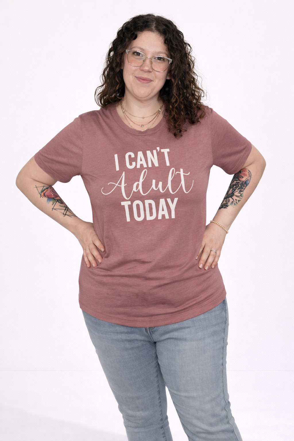 Person wearing a mauve t-shirt with 'I Can't Adult Today' text on a white background