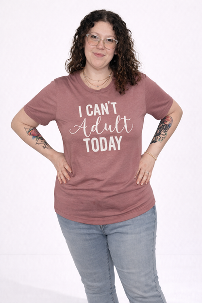 Person wearing a mauve t-shirt with 'I Can't Adult Today' text on a white background
