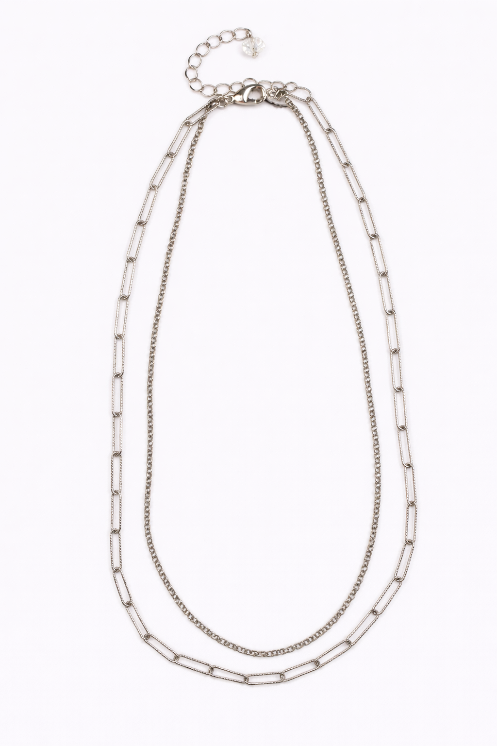 Silver chain necklace on a white background