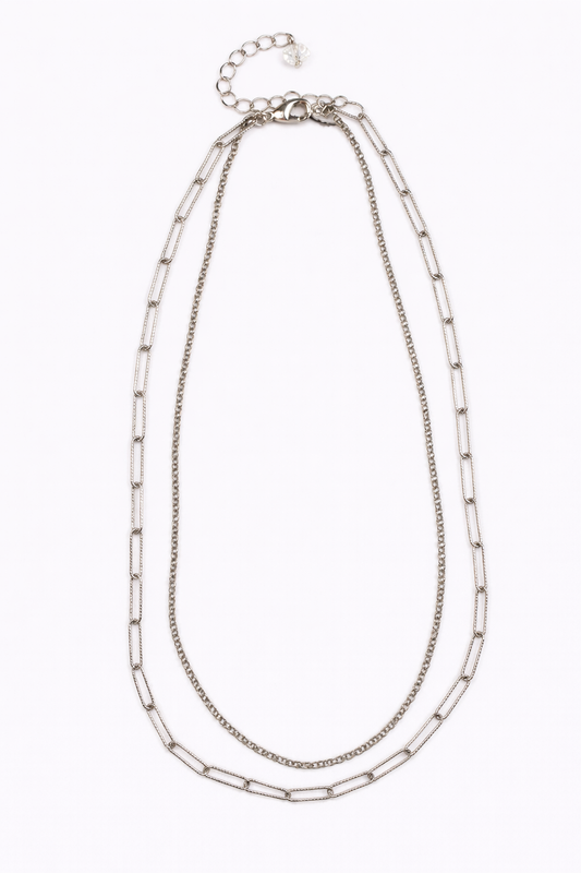 Silver chain necklace on a white background