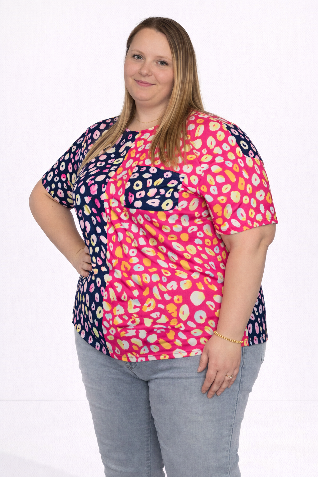 Woman wearing a colorful patterned shirt on a white background