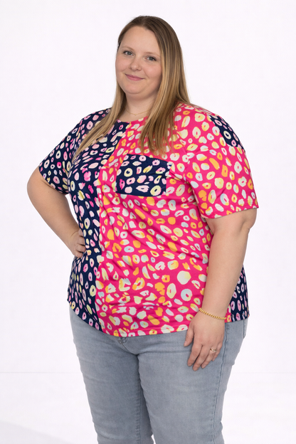 Woman wearing a colorful patterned shirt on a white background