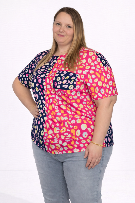 Woman wearing a colorful patterned shirt on a white background