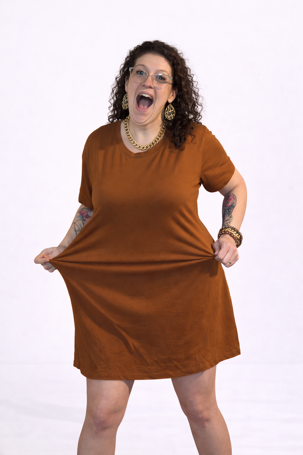 Woman wearing a brown dress on a white background